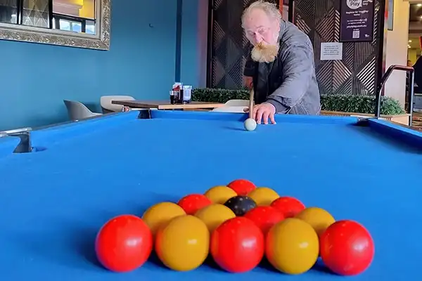 Paul playing pool