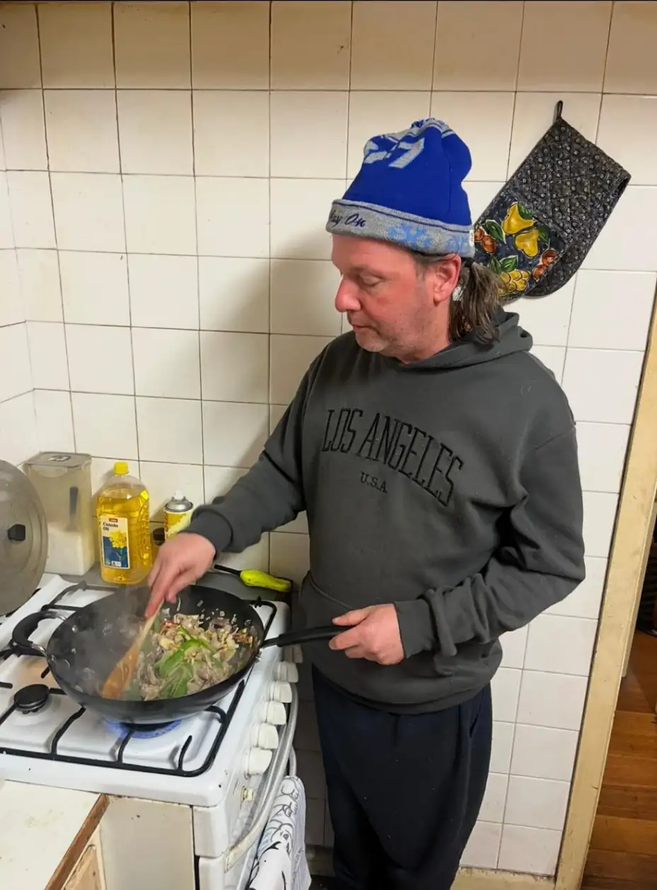 Ray cooking dinner on stove